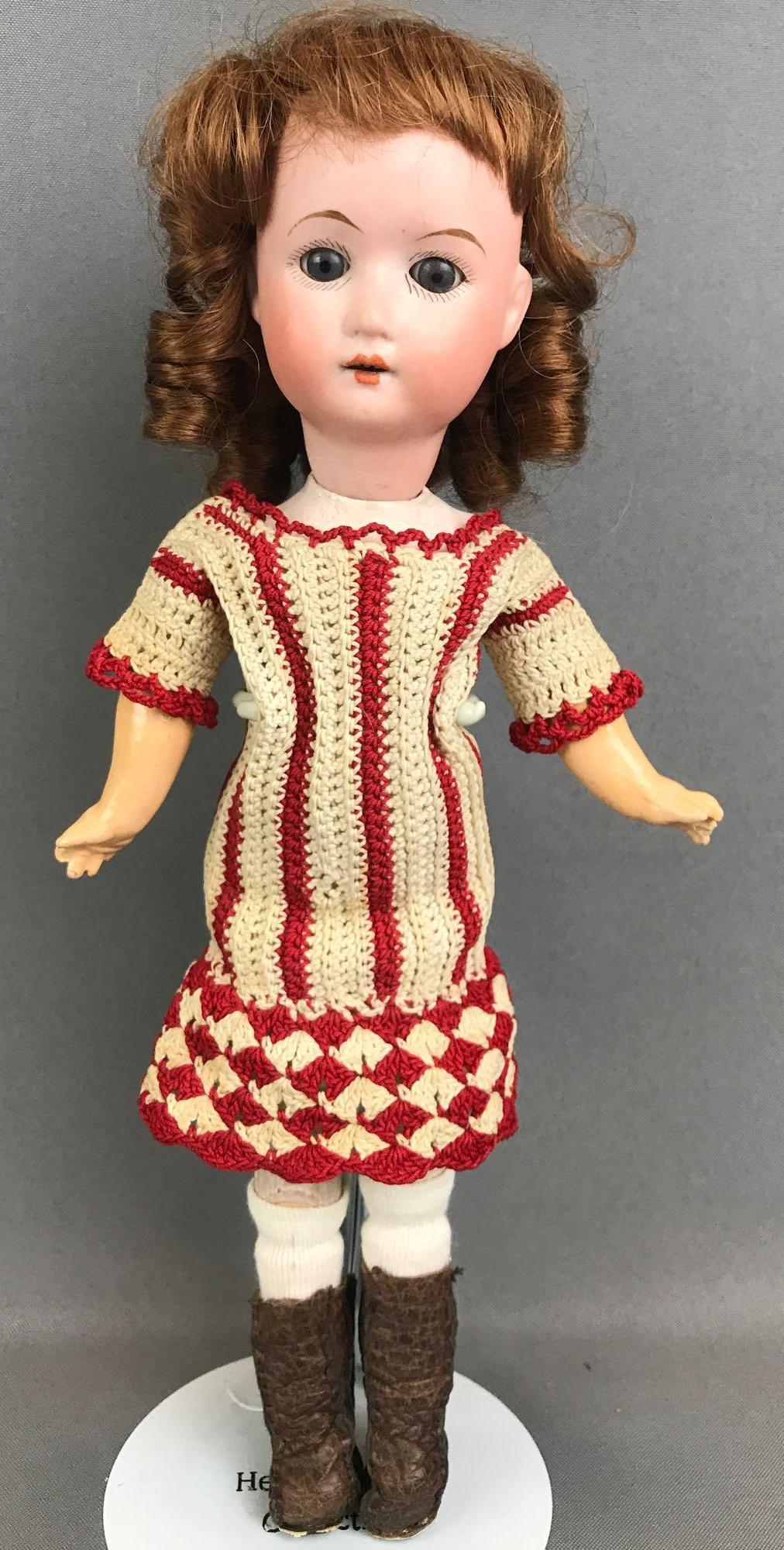 Antique 13 inch German bisque doll William Goebel: WG, with crown symbol, 120 3/0, Germany. Socket head, blue glass sleep eyes with painted lashes, open mouth with teeth, composition and wood body. Crocheted dress, bloomers, stockings, boots. Replacem