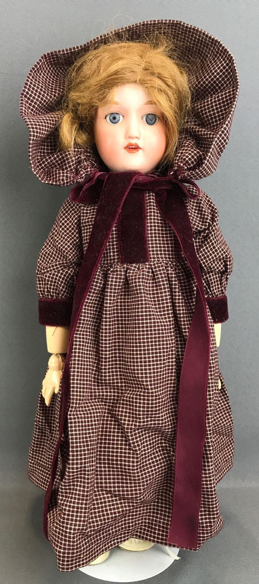 Vintage 17 inch Japan bisque doll Yamato: FY Nippon, 402. Socket head, blue glass stationary eyes with painted lashes, open mouth with teeth, composition jointed body. Maroon checked dress and bonnet, under garments, stockings, shoes. Brown h