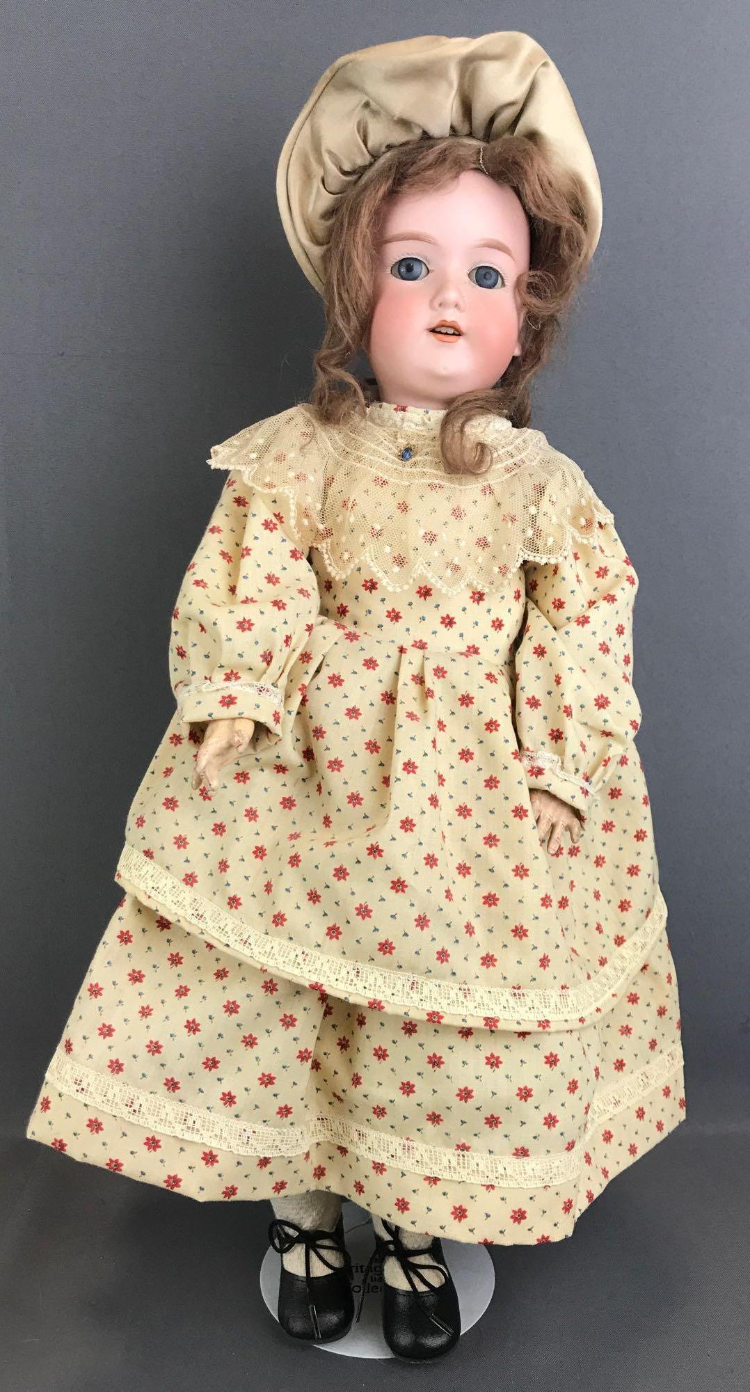 Antique 20 inch German bisque doll Marseille: Armand Marseille, 390, A 5 M. Socket head, blue glass sleep eyes with painted lashes, open mouth with teeth, composition and wood jointed body. Floral dress, bonnet, under garments, stockings, shoes. 