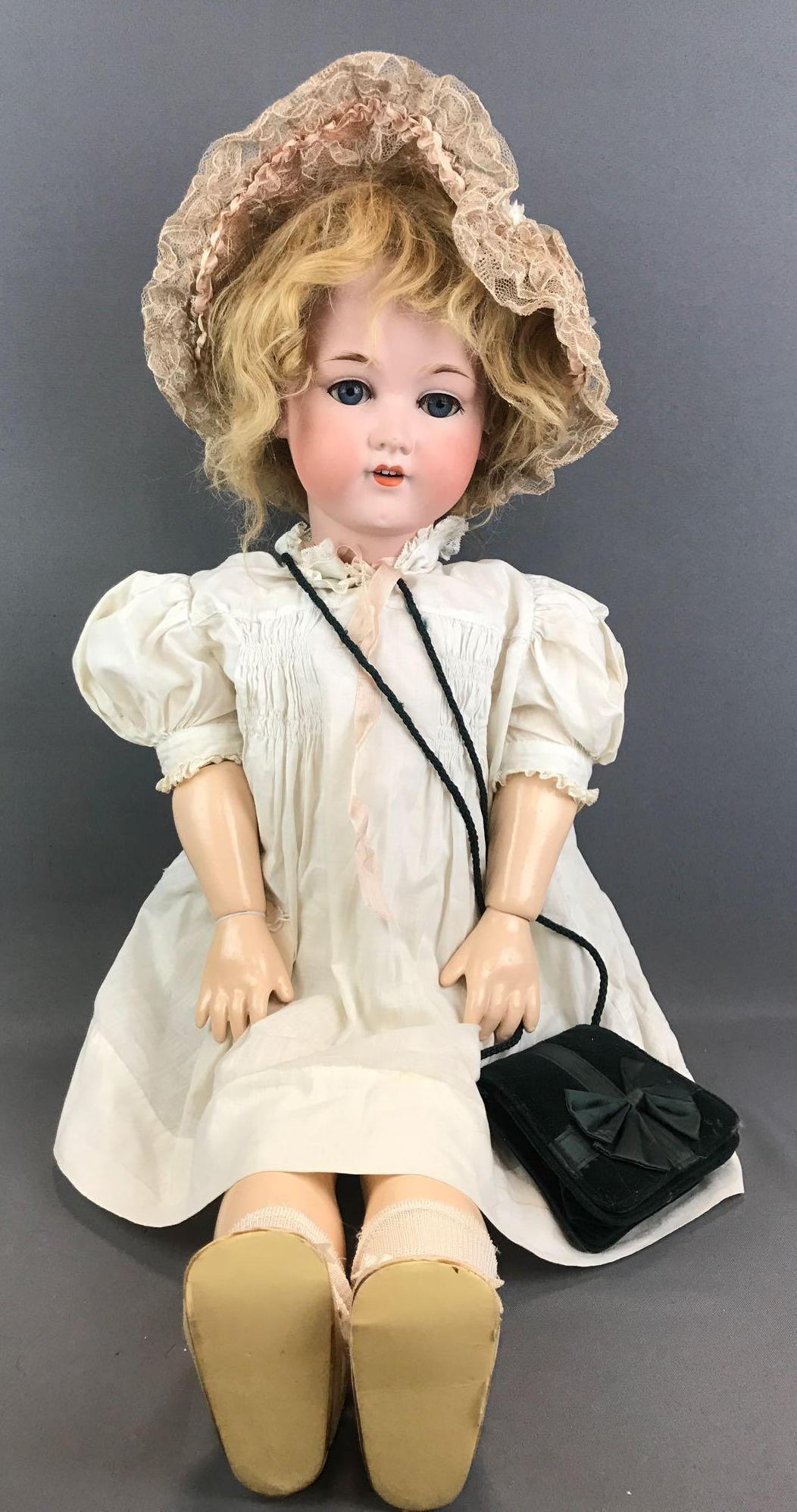 Antique 34 inch German bisque doll Marseille: Armand Marseille, 390, Germany, A 15 M. Socket head, blue stationary glass eyes with painted and applied lashes, open mouth with teeth, reproduction composition body. White dress, bonnet, bloomers, so