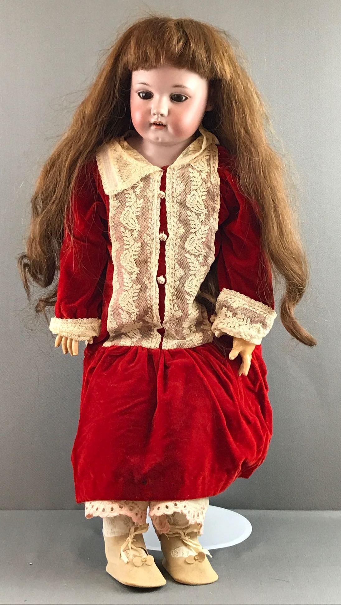 Antique 30 inch German bisque doll Simon & Halbig: Germany, Simon & Halbig, all other writing is below leather. Shoulder head, brown glass sleep eyes with painted and applied lashes, pierced ears, open mouth with teeth, leather and fabric body with co