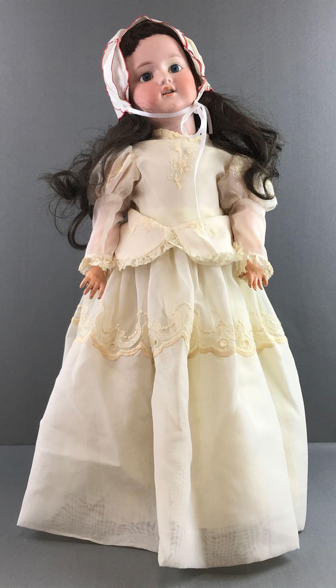 Antique 24 inch German bisque doll George Borgfeldt: Back of head read Germany GB, no other markings. Socket head, blue glass stationary eyes with painted lashes, open mouth with teeth, composition and wood body. Off white dress, bloomers, stockings, sh