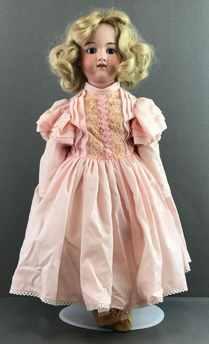 Antique 23 inch German bisque doll Marseille: Made in Germany, Armand Marseille, 390n, DRGM 246/1, A 6 M. Socket head, blue glass stationary eyes with painted lashes, open mouth with teeth, composition and wood jointed body. Pink dress, under gar