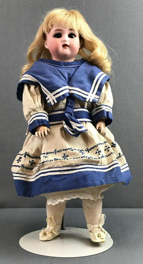 Antique 14 inch German bisque doll Kammer &: K (star) R, 36. Socket head, brown glass sleep eyes with painted and applied lashes, open mouth with teeth, pierced ears, composition and wood jointed body. Usual wear to body and limbs, paint loss, c