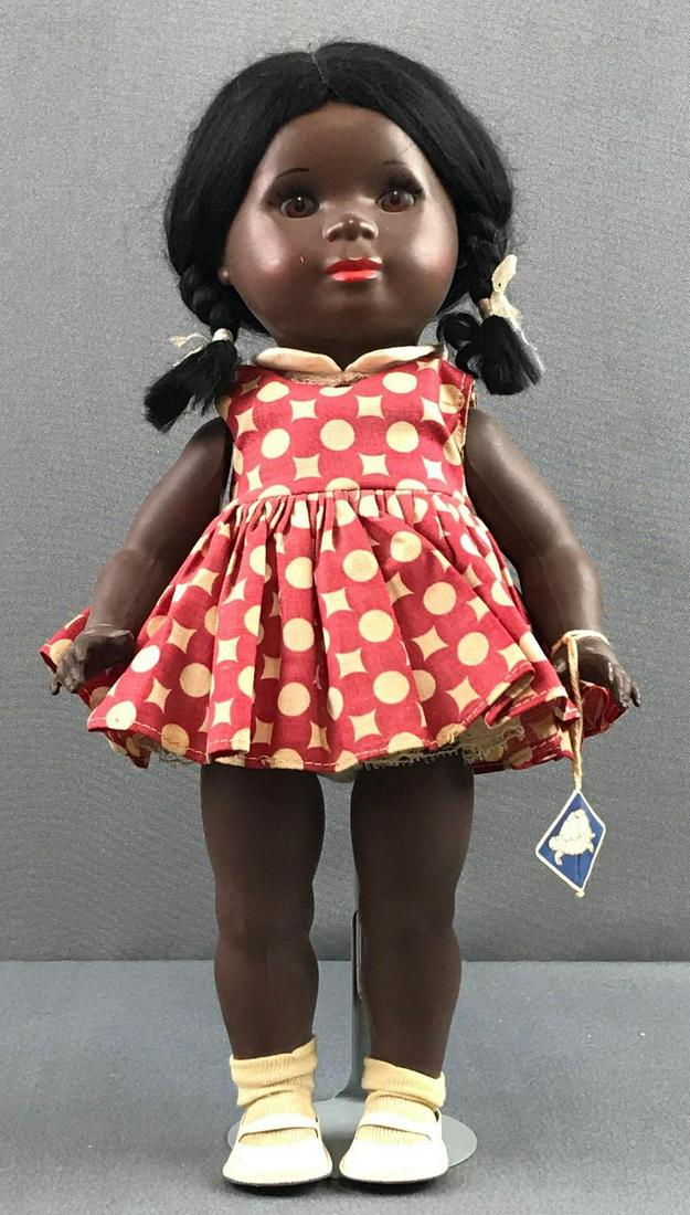 Vintage celluloid turtle mark doll: Measures 13 inches. Black skin tone. Head and body are marked with a turtle in a diamond, 34. Arms are loose. Nice condition.