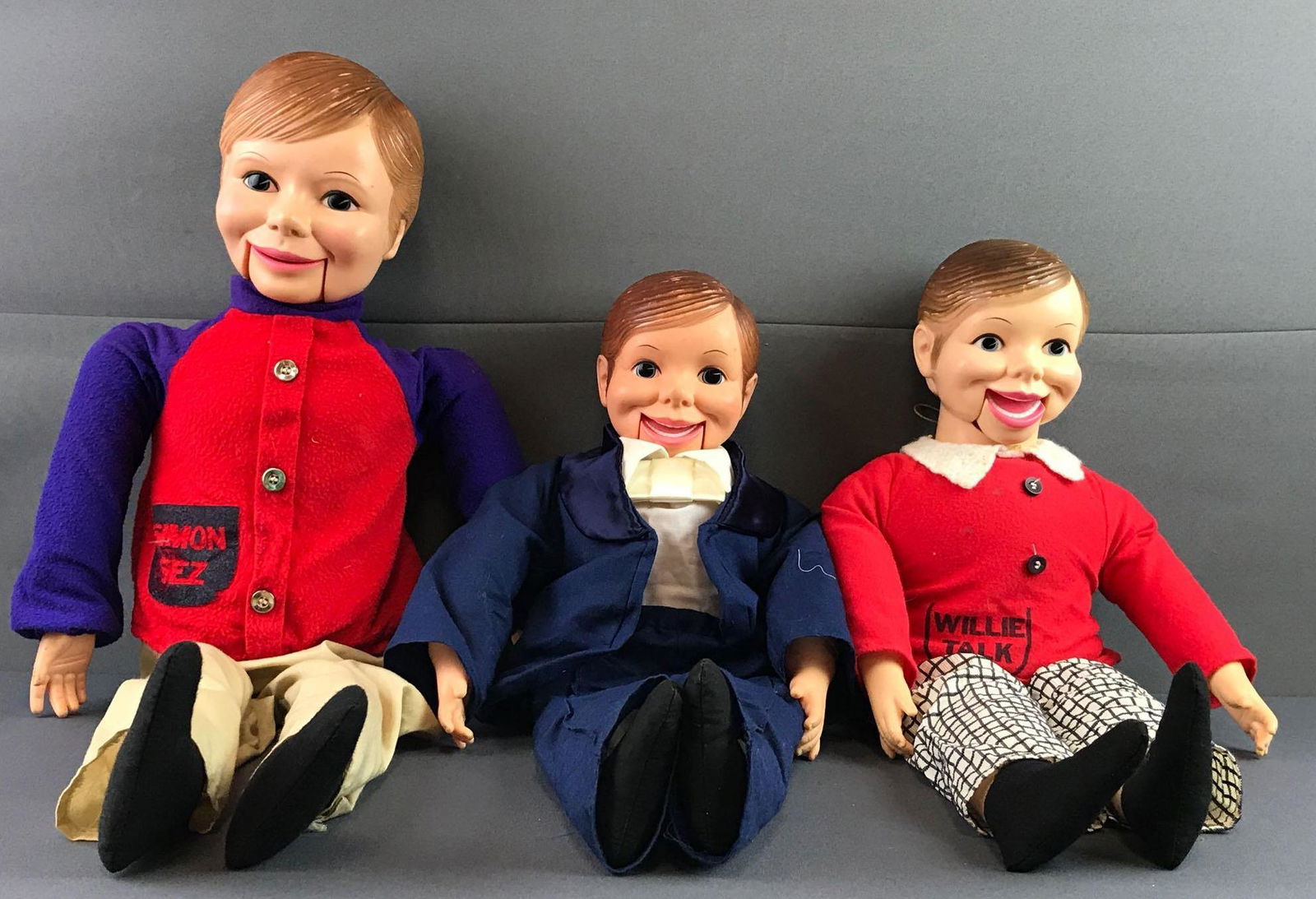 Group of 3 Horsman Dolls Ventriloquist puppets: Plastic with soft body. Includes Simon Sez, soft body shell missing, Willie Talk and in tux. Largest measures 29x11x6 inches, paint loss and stains throughout group, in used condition, wear consistent