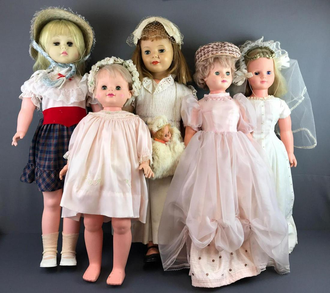 Group of 5 sleep eyes large dolls: Largest measures 25x22.5x6 inches. Includes Uneeda Dolls Co., Ideal Doll, and more. Some loose joints, damaged eyes, cut hair and clothing stains, in used condition.