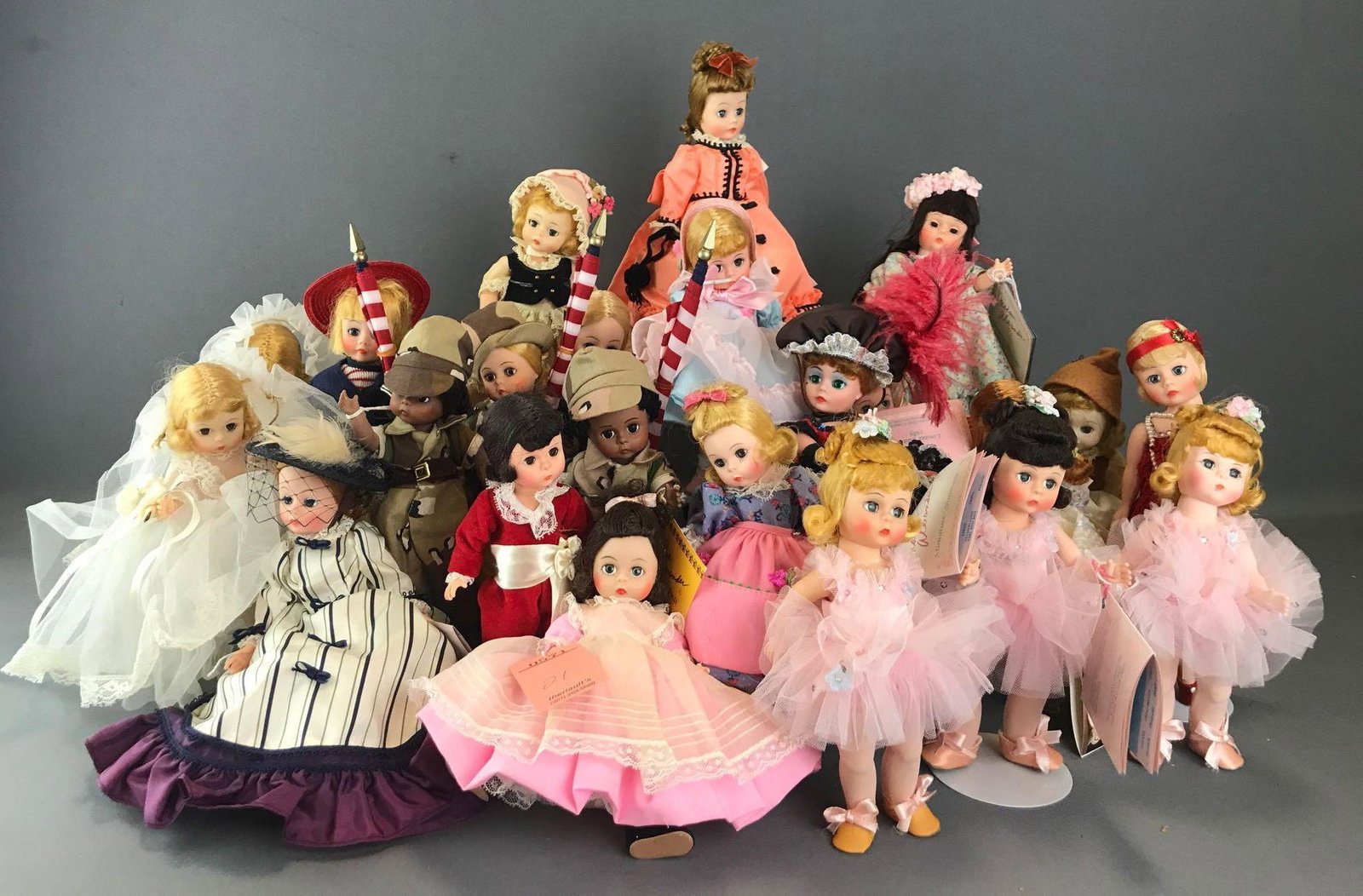 Group of 20+ Madame Alexander dolls: Includes Ballerina, Bo Peep, Jane Avril, and more. Dolls are 8 inches with sleepy eyes and straight legs. Some loose joints, unknown completion. Stands not included