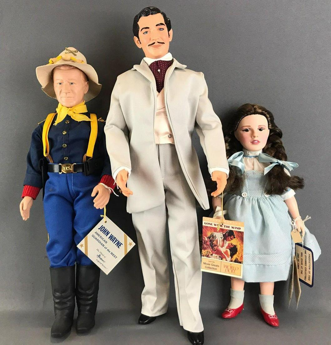Group of 3 assorted movie character dolls: Effanbee John Wayne American Guardian of The West and Dorothy (Wizard of Oz). Rhett Butler is from World Doll, stands 20 inches tall, head is no longer attached. All dolls are plastic