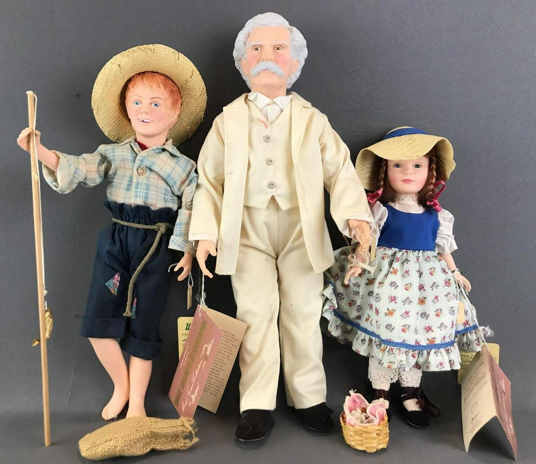 Group of 3 Effanbee Mark Twain Collection dolls: Includes Mark Twain, Huck Finn, and Becky Thatcher. Dolls are plastic with fixed lids. Largest is . Unknown completion