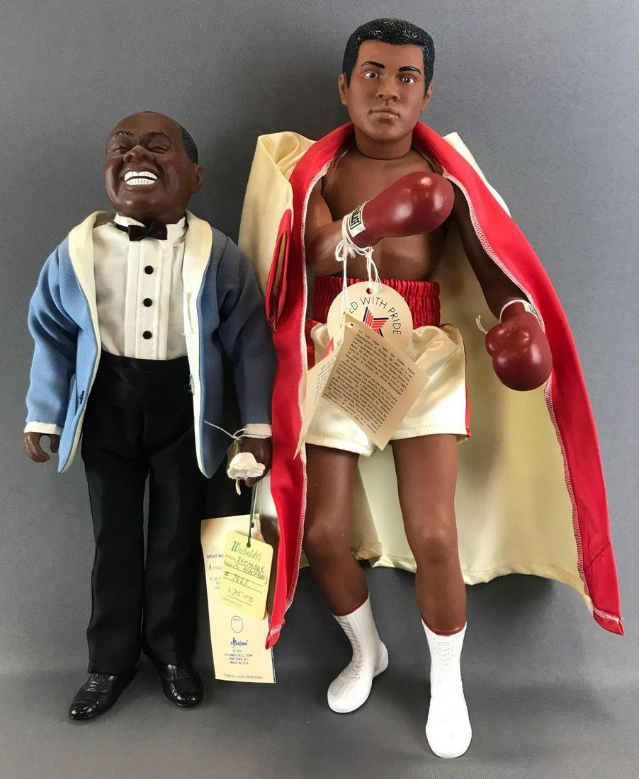 Group of 2 Effanbee Great Moments dolls: Includes Great Moments in Music Louis Armstrong and Great Moments in Sports Muhammad Ali. Largest is 17.5 inches. Dolls are plastic
