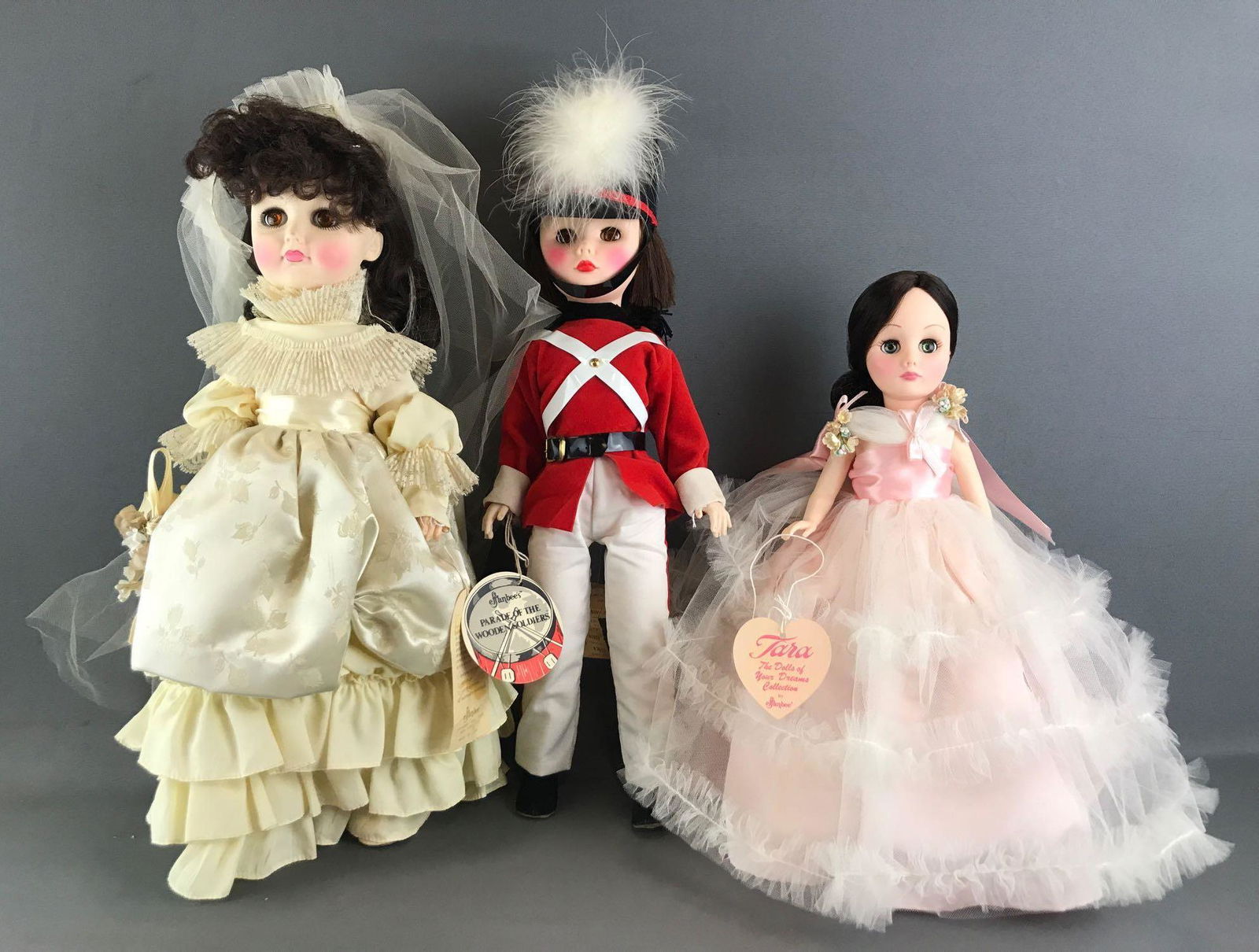 Group of 3 Effanbee dolls: Includes The Age of Elegance Collection Westminster Cathedral, Parade of The Wooden Soldier 18 inch Toy Soldier, and The Dolls of Your Dreams Collection Tara. Largest is 18 inches. Plastic, unknown co