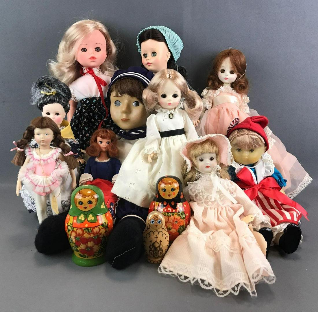 13 piece group of assorted dolls: Russian Nesting Dolls, Ideal Dolls, Enesco Nostalgic Doll, and more. Largest is 20 inches