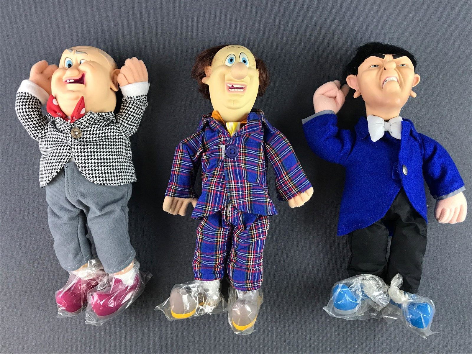 Group of 3 Three Stooges Plush Dolls: Measures 12x7x3.5 inches and includes Larry, Moe and Curly, like new condition.