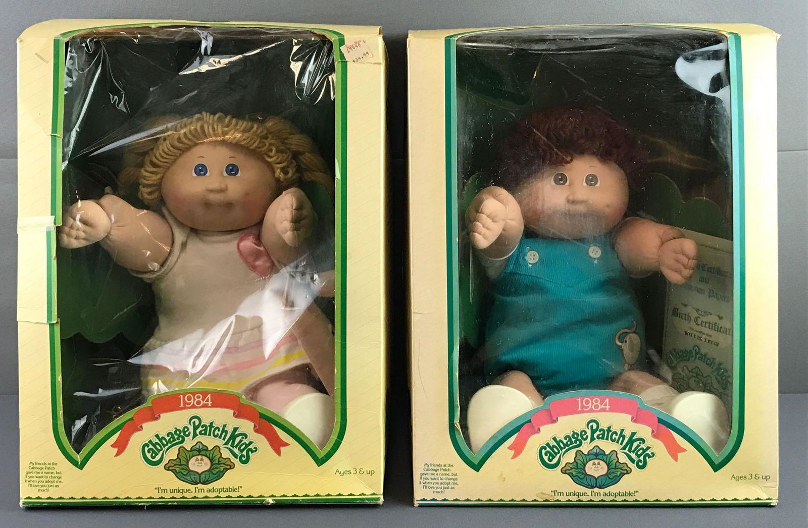 Group of 2 1984 Cabbage Patch Kids in original: Includes Willis Leon and Kelsey Loren, packaging has tears and cellophane detached. Like new condition measuring 11.5x14.5x11.5 inches.