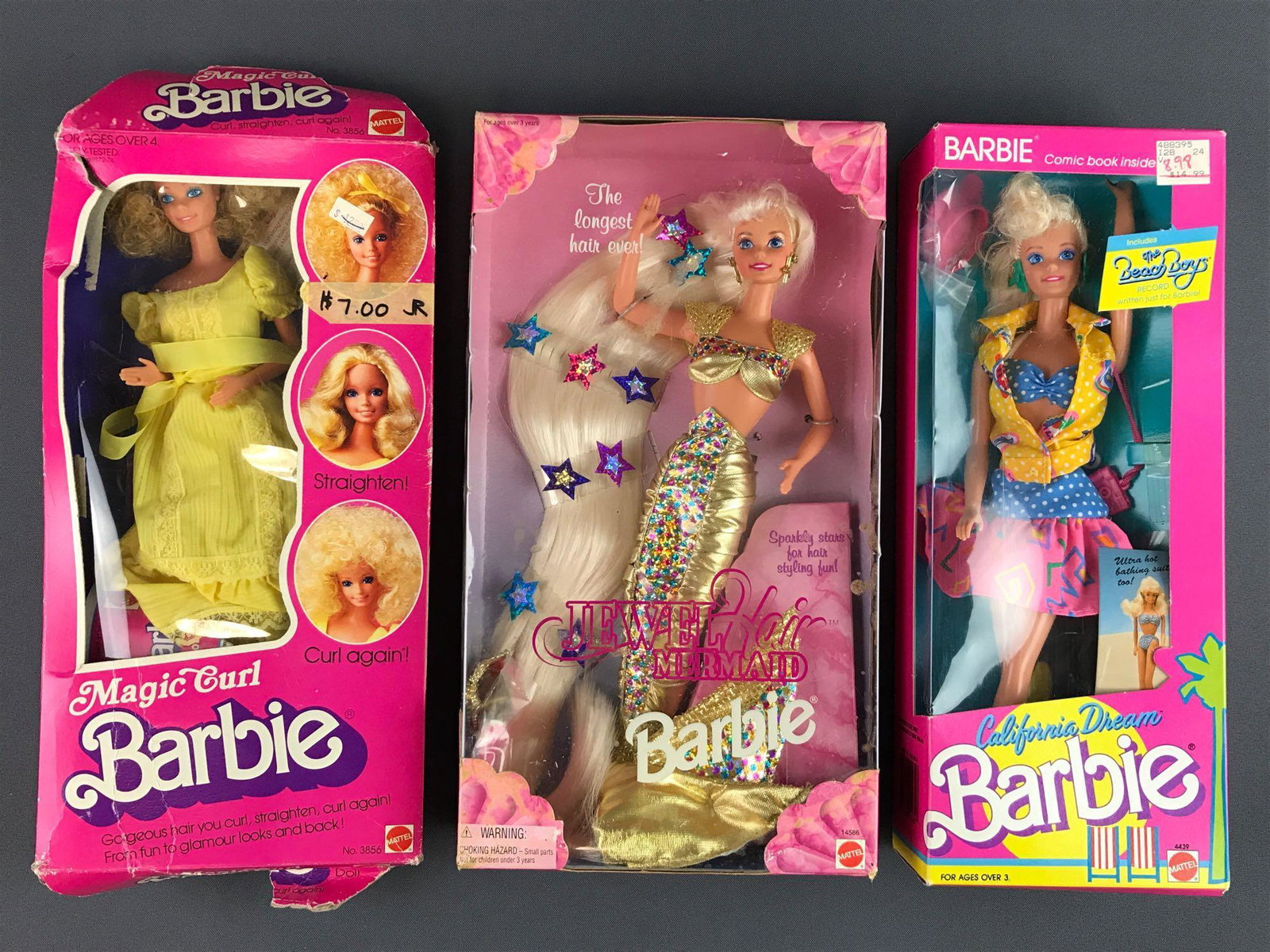 Group of 3 Mattel Barbies in original packaging: Includes California Dream No. 4439 manufactured 1987, includes Beach Boys record, NIB with shelf wear to packaging; Jewel Hair Mermaid No. 14586 manufactured 1995, NIB with shelf wear to packaging ; a