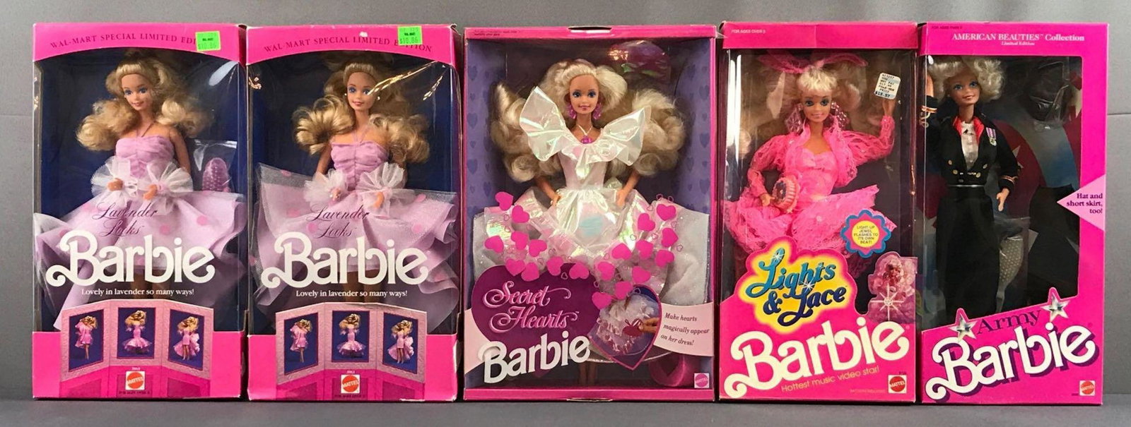Group of 5 assorted Mattel Barbies in original: Includes Lavender Looks No. 3693, Secret Hearts No. 7902, Lights and Lace No. 9725 and Army No. 3966 manufactured 1989â€“1992. Measures 8x13x2.5 inches, packaging has shelf wear, NIB. Includes du