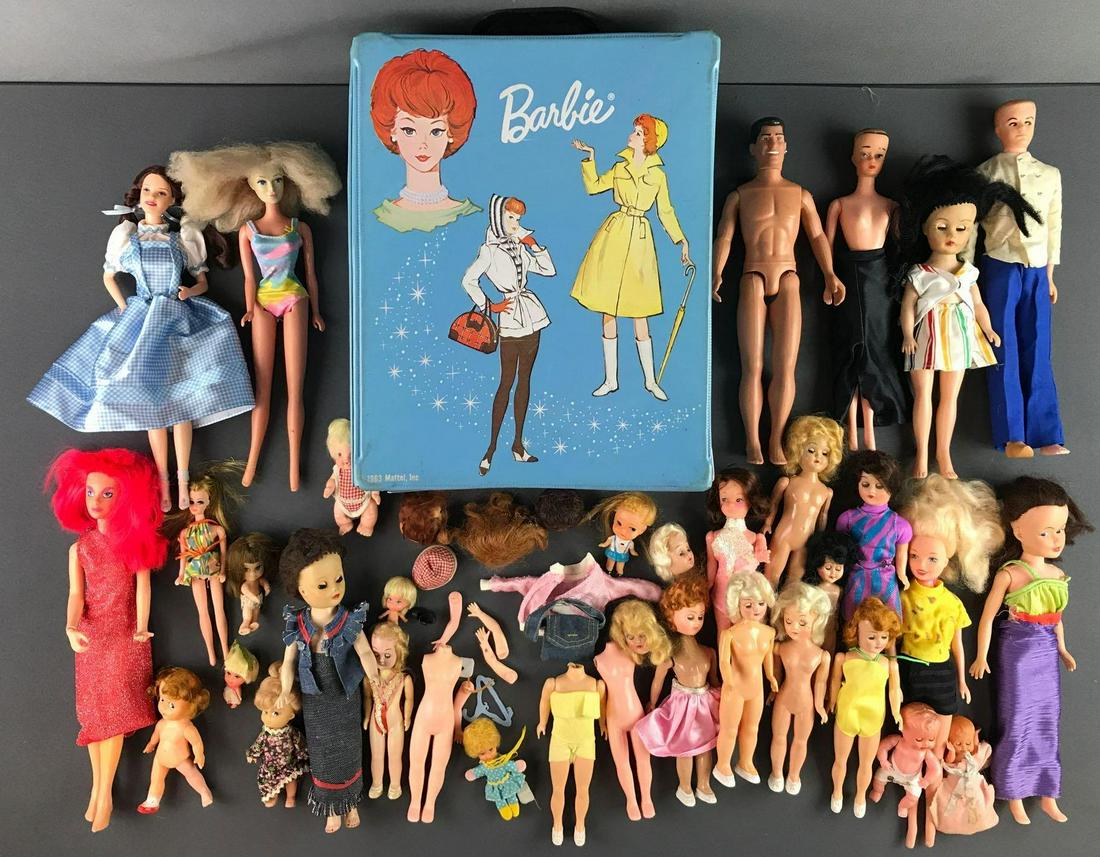 Group of approximately 50 assorted dolls and more: Includes assortment of dolls including vintage unmarked with sleepy eyes and modern, broken doll pieces of arms, hands and more. Mattel Barbie case measures 11x13x7 inches with rip in seam. Wear consi
