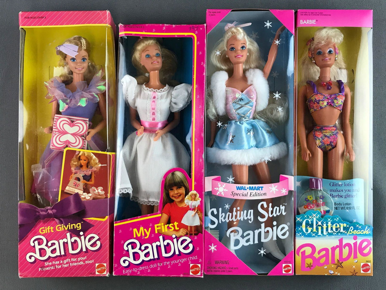 Group of 4 Mattel Barbies in original packaging: Includes No. 3602 Glitter Beach, No. 15510 Skating Star, No. 1875 My First Barbie and No. 1922 Gift Giving Barbie. Manufactured 1984â€“1995. Box has shelf wear, NIB.