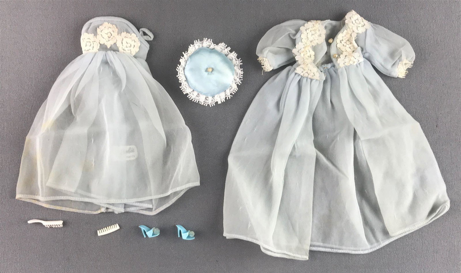 Group of 7 Mattel Barbie Sleeping Pretty Fashion: Includes pillow, nightgown, robe and more. In used condition, wear consistent with age, some staining.