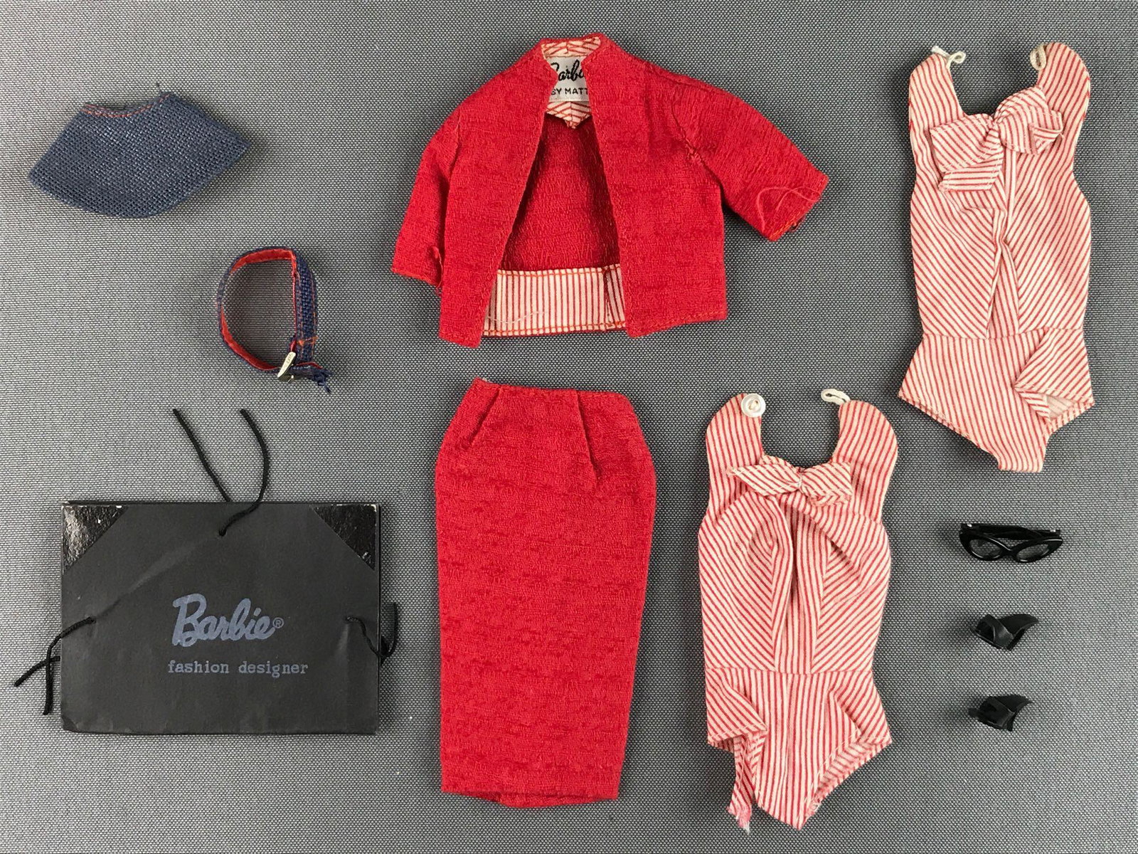 Group of 10 Mattel Barbie Busy Gal fashion: Includes belt, jacket, glasses and more. Wear consistent with age and use, in used condition. Clasp detached from skirt and rip on bottom of shift near leg and button missing on other.