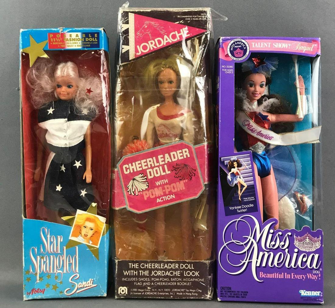 Group of 3 assorted vintage fashion dolls in original: Kenner Miss America, Totsy Star Spangled Sandi, and Mego Jordache Cheerleader doll. Dolls are 11.5 inches