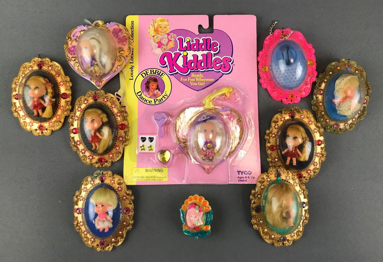 Group of 10 Mattel Little Kiddles Lovely Locket: Largest is 4x3.5 inches, (9) dolls and (1) empty locket