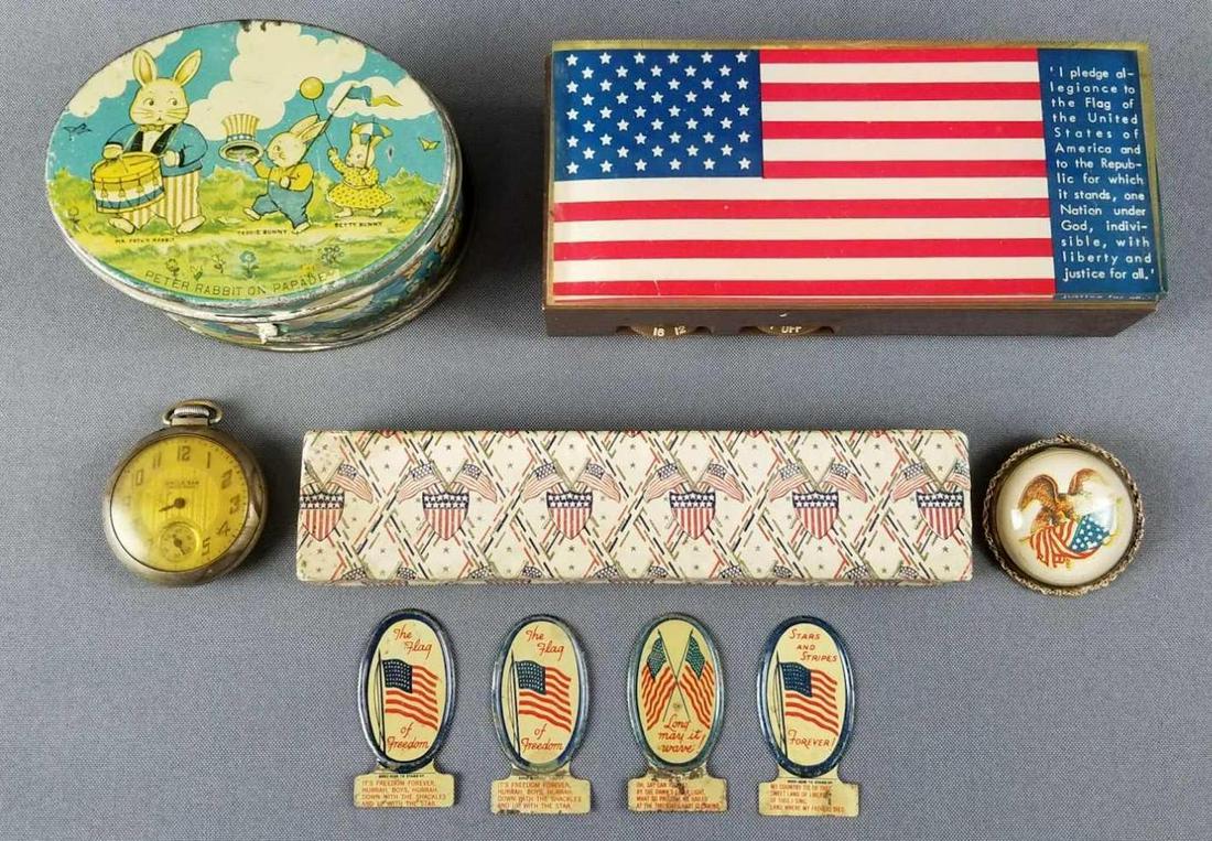 Group of patriotic items: Uncle Sam pocket watch, pendant, radio, tin, and more.
