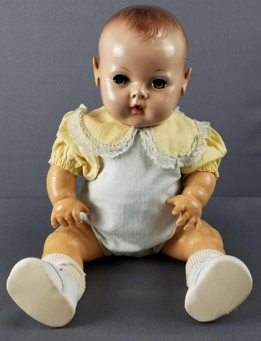Vintage Dy-dee baby by Effanbee: Cracking to arms and legs. Circa 1950s. Sleep eyes. 15 inches long