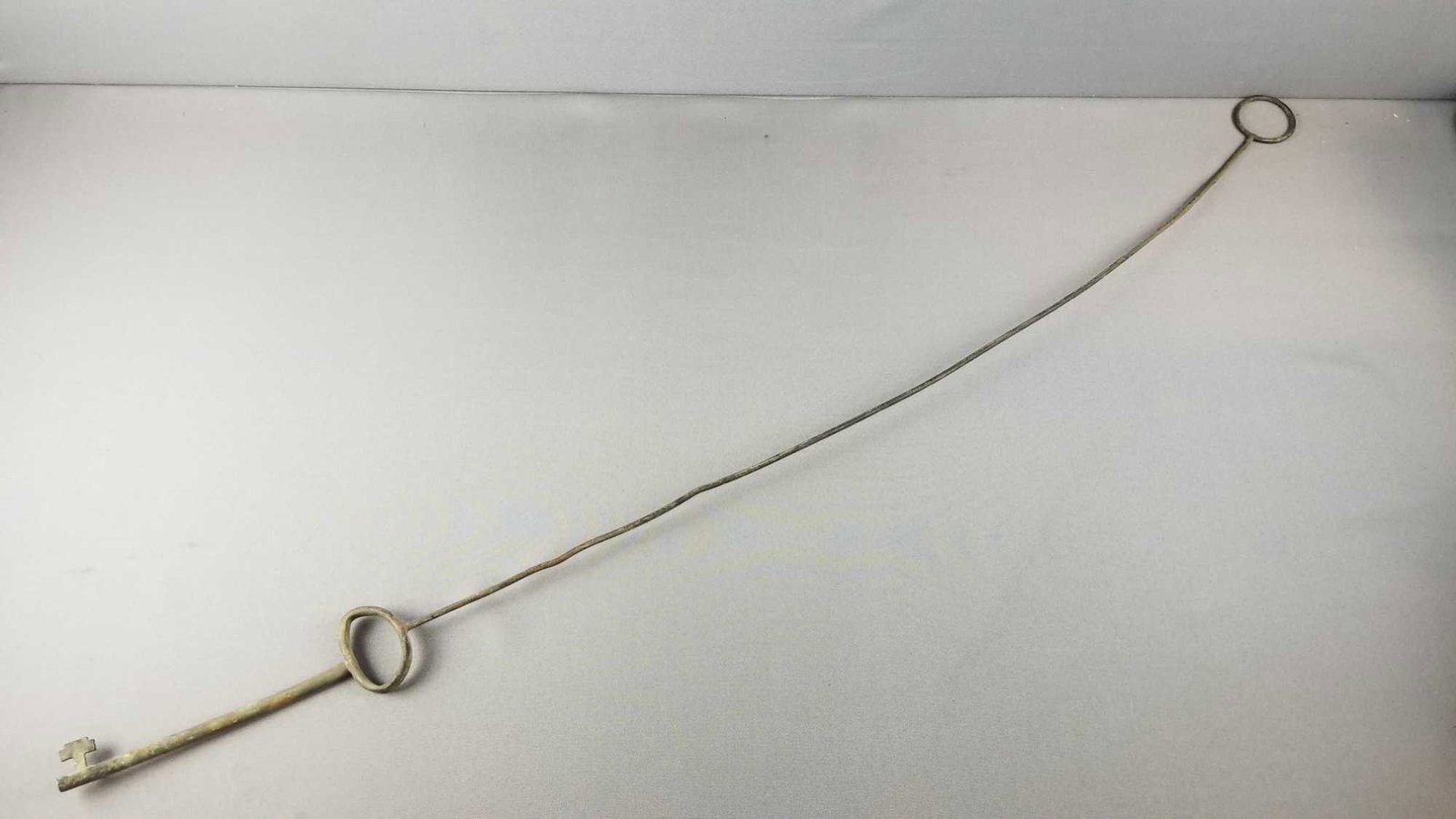 Antique Key attached to metal pole and ring: 47.5 inches long