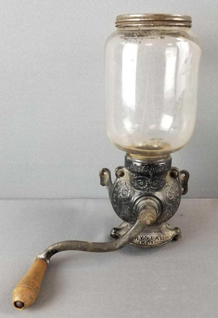 Arcade cast iron wall mount coffee grinder: Arcade Crystal no 1. Glass is chipped at lip (under lid), wall mount is broken at one screw hole. 12 inches tall