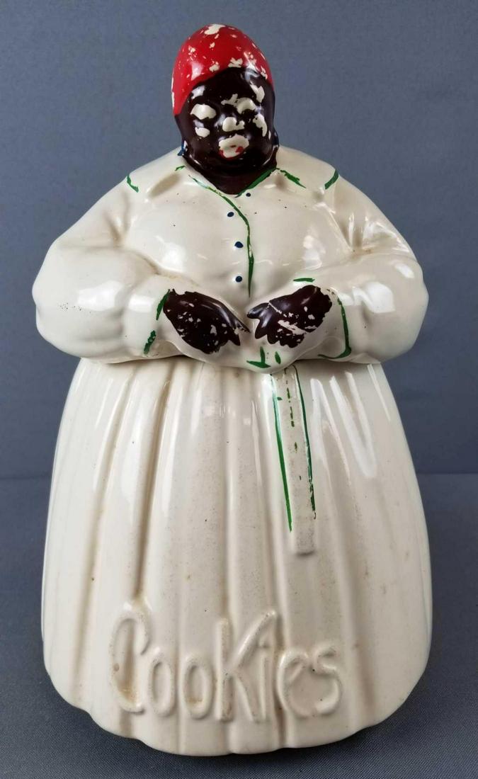 McCoy Mammy cookie jar: Black Americana. Paint loss, some chips and cracks. 11 inches tall