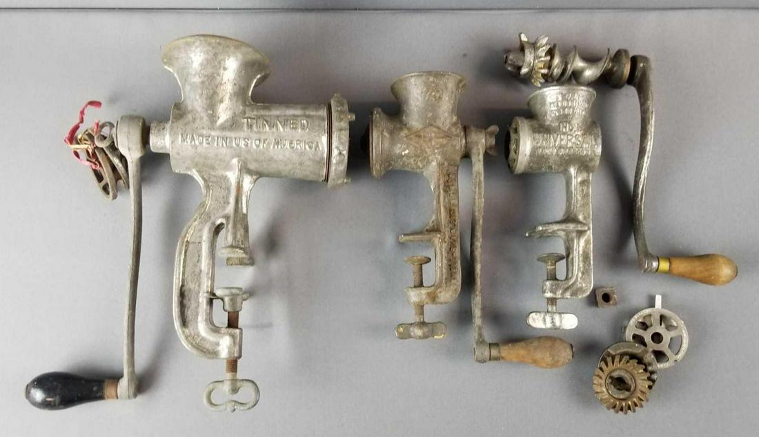Group of antique grinders: Grinders and parts. No 1 universal, enterprise. Largest is 13 inches