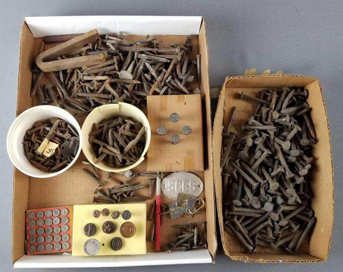 Group of railroad and utility date nails and more: Some copper, some larger spikes