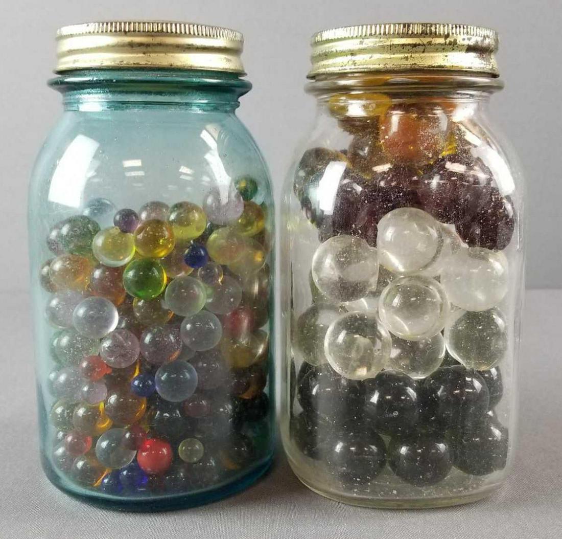 2 jars of marbles: Jars are 7 inches tall, marbles are various sizes