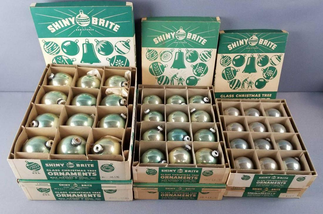 Group of vintage round glass Christmas ornaments: 6 Shiny Brite boxes, 2 of each size. Boxes are labeled Blue. Ornaments are faded. Each box contains one dozen. Condition consistent with age and use.