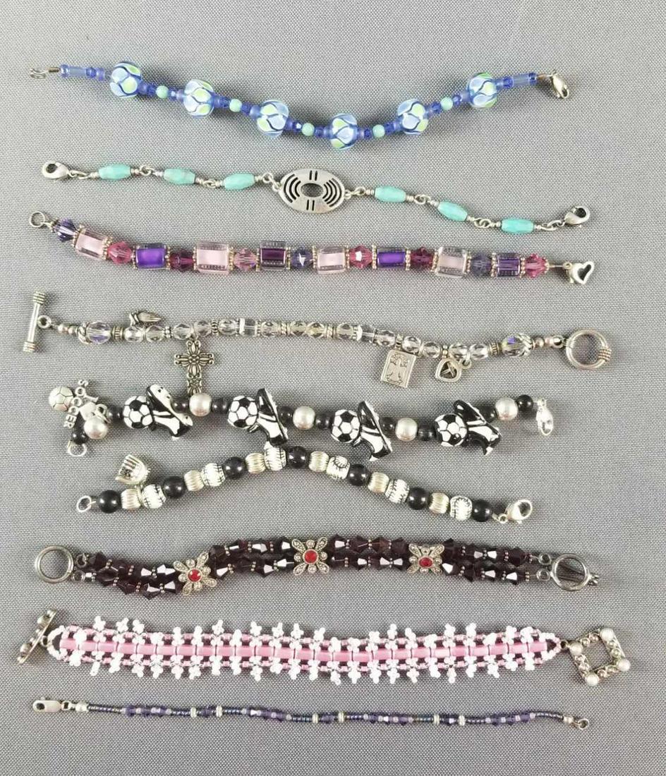 Group of 9 beaded bracelets with sterling silver: All have some sterling on them. Longest bracelet is 7.5 inches