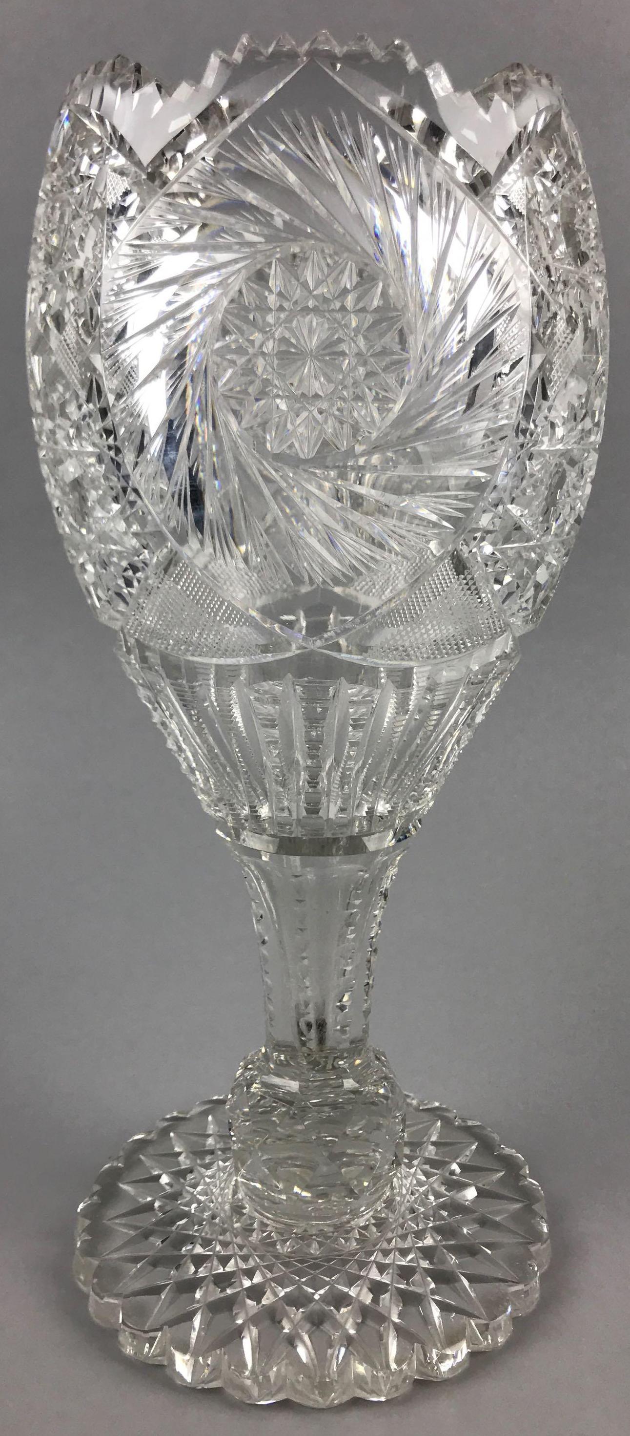 American Brilliant Period Cut Glass Vase: 11 1/2 inches tall. Crosshatch, star patterns; some minor chips and wear