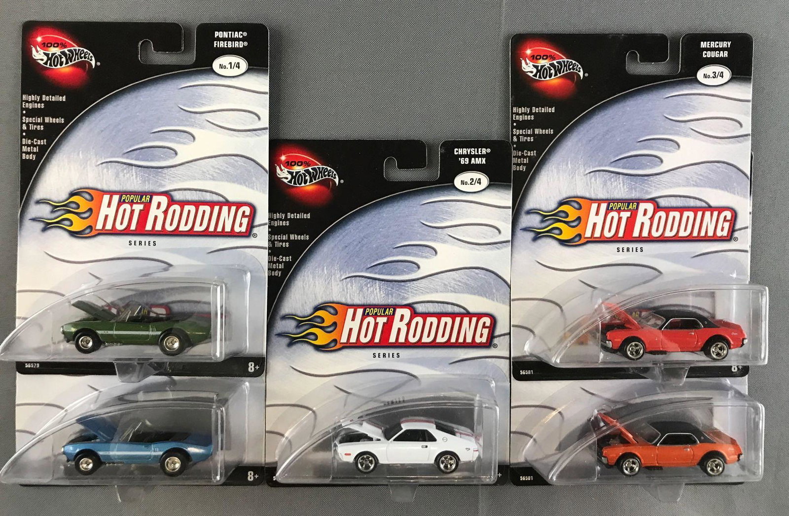 Group of 5 100% Hot Wheels Popular Hot Rodding die-cast: New in original packaging, includes (2) Pontiac Firebird (variant), Chrysler AMX, and (2) Mercury Cougar