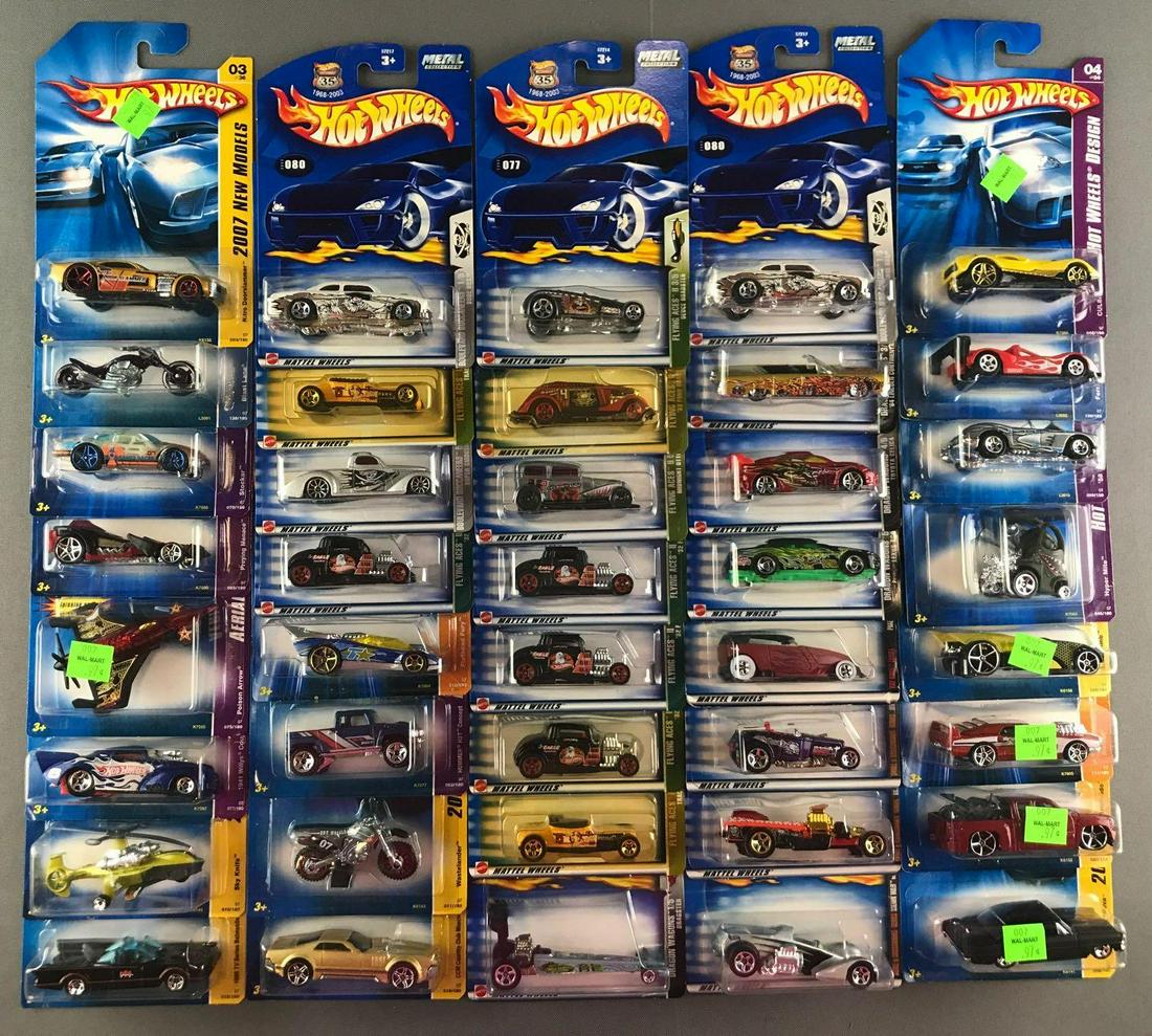 Group of 40 assorted Hot Wheels die-cast vehicles: New in original packaging, includes Skull & Crossbones Series, Flying Aces, Hot Wheels Design, and more