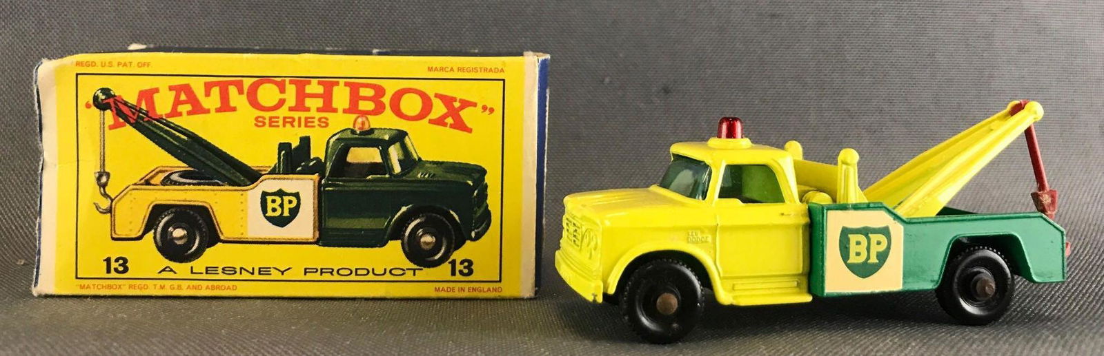 Matchbox No. 13 Dodge Wreck Truck die-cast vehicle: Includes original box. Yellow body, green base, blue/green windows, BPW, BP decals. Some damage to box-missing flap. A Lesney Product. Made in England