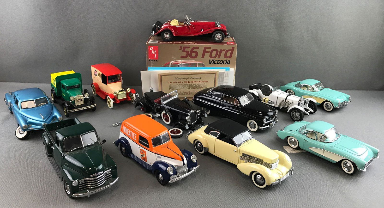 Group of 13 die-cast and Kit vehicles: Includes multiple scale banks and cars by Franklin Mint Precision Motors, Danbury Mint, Ertl and more. Damage throughout group.