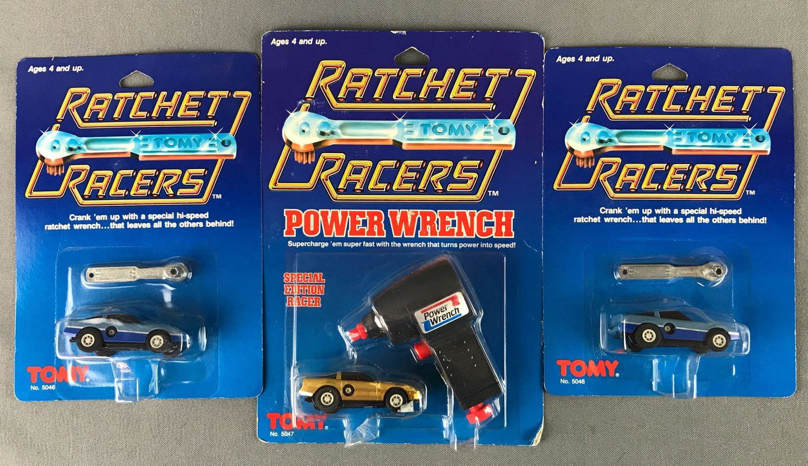 Group of 3 Tomy Ratchet Racers: Includes two no. 5046 and Power Wrench special edition racer no. 5047 die-cast, new old stock.