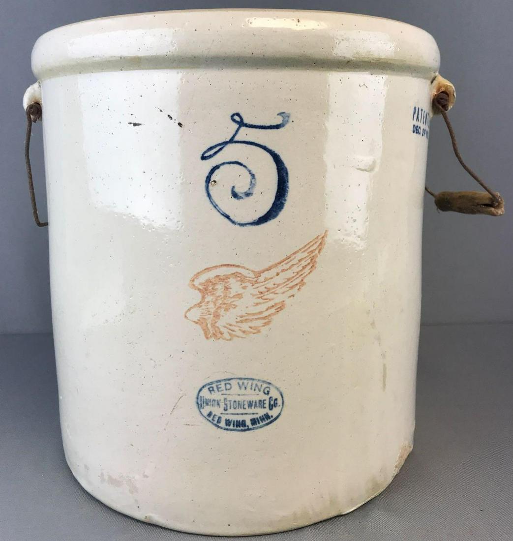 Red Wing Union Stoneware Co 5 gallon crock with handles: 14x13.25 inches, metal on handles has rusted, (1) wood handle missing, chip on base