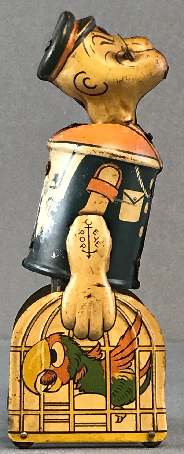 Walking Popeye wind up tin toy: By Unique Art Manufacturing Co., Inc., made in the USA. Measures 8.25x3x2.75 inches with reproduction box. Wear consistent with age and use. Tested and legs operate but doesnâ€™t walk.