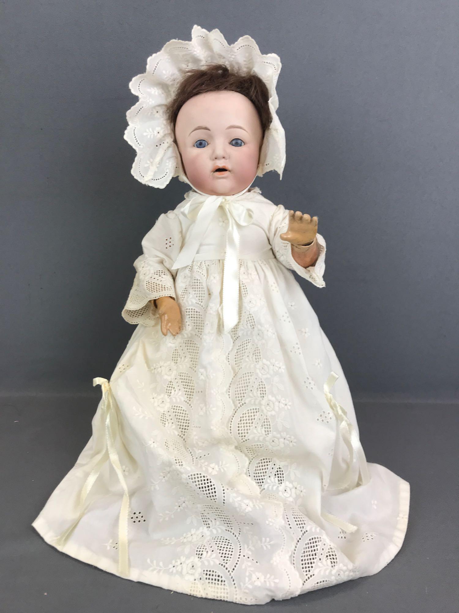 Vintage 12 inch Japan bisque doll FY: FY, Nippon, 602. Yamato importing company. Socket head, blue sleep eyes with painted lashes, open mouth with teeth, composition body with bent limbs. Ivory colored gown, bonnet, under clothing. Paint 