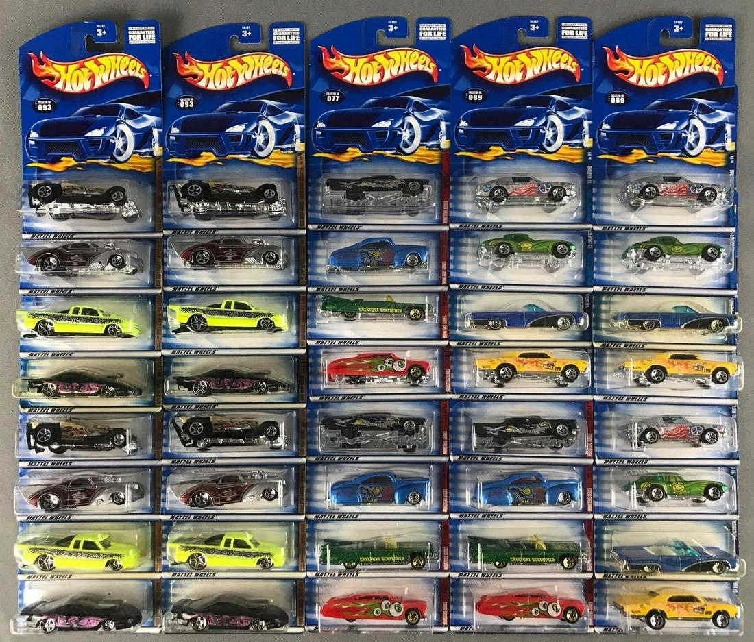 Group of 40 assorted Hot Wheels die-cast vehicles: Includes Hippie Mobiles Series, Monsters Series, and Skin Deep Series