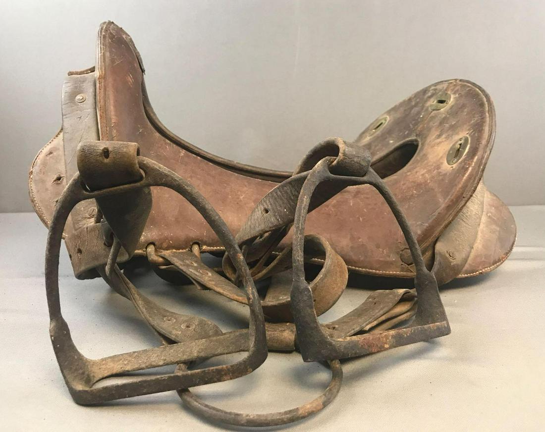 WW1 US Cavalry Leather Saddle: 12 inch seat, appx . Includes straps and stirrups. Weathered