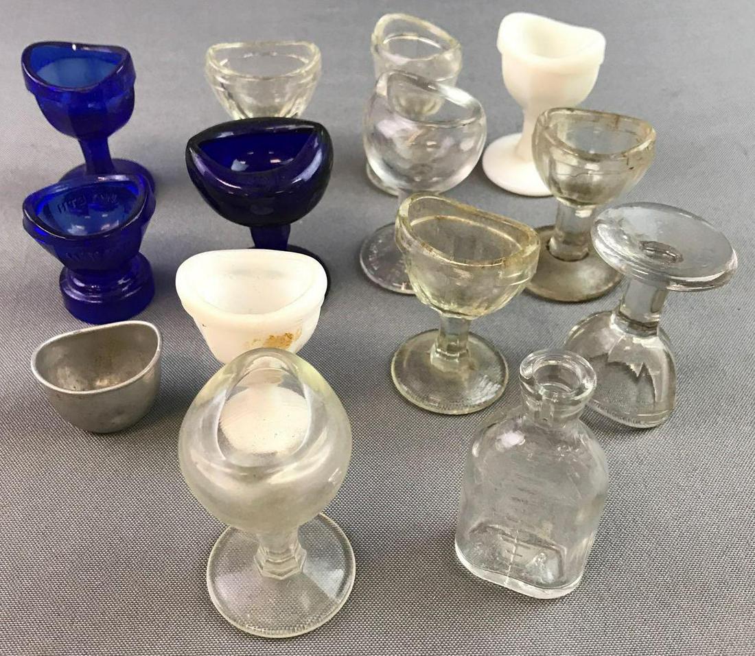 Group of glass/metal eye wash cups (1 of 2)