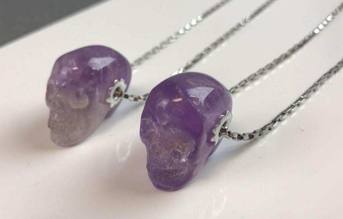 Pair of Skull Necklaces: Each skull measures 1.25 x .5 x 1 inches.